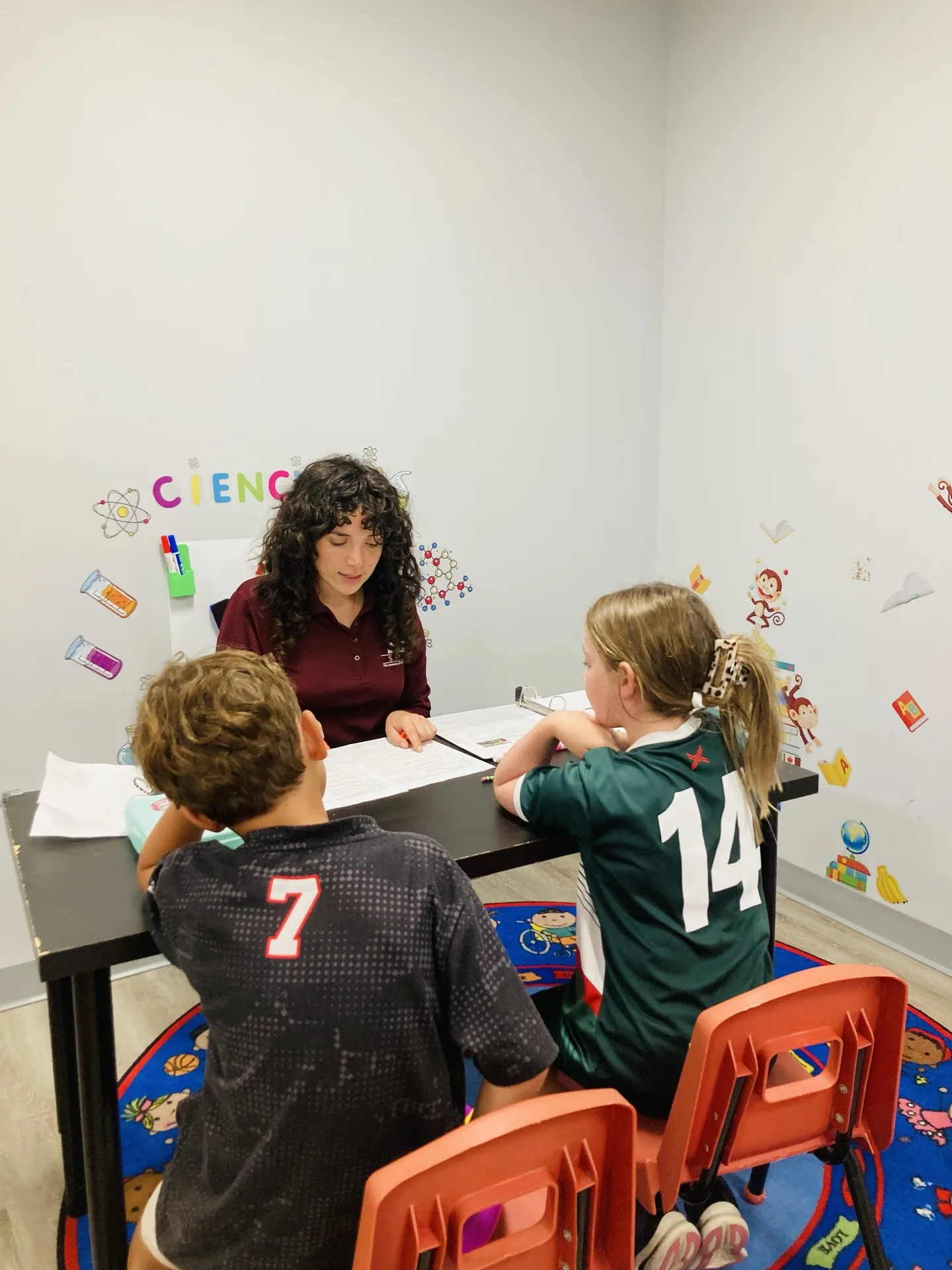 SELA students laughing together during an afterschool activity