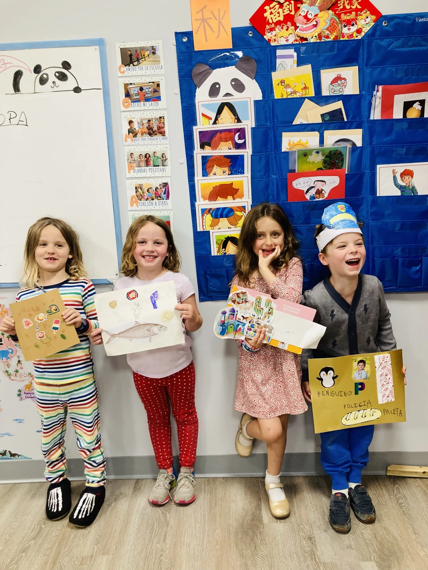 SELA children working side by side on a shared activity