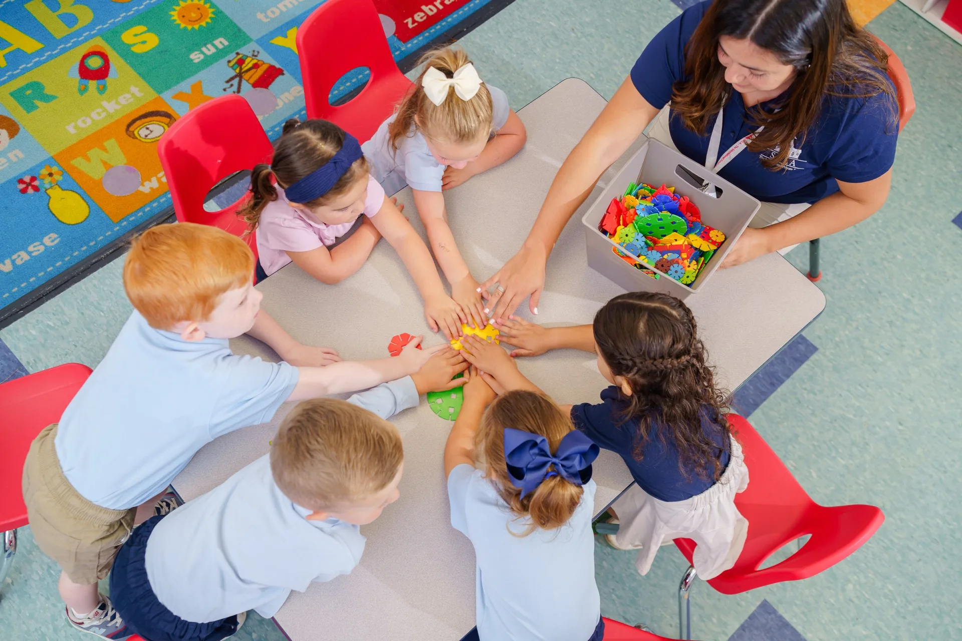 An elementary classroom moment as students work through their day across languages.